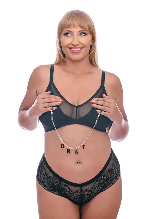 Brat Charmed Nipple Clamps with rose gold chain spelling out BRAT.