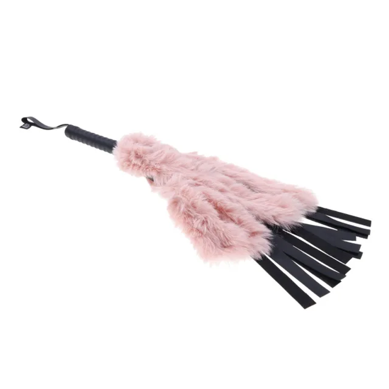 Pink faux fur flogger with black vegan leather falls and a black handle.