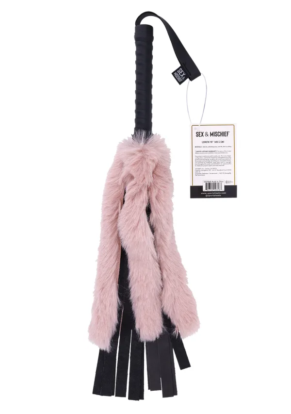 A rose gold flogger with pink faux fur and black vegan leather falls.