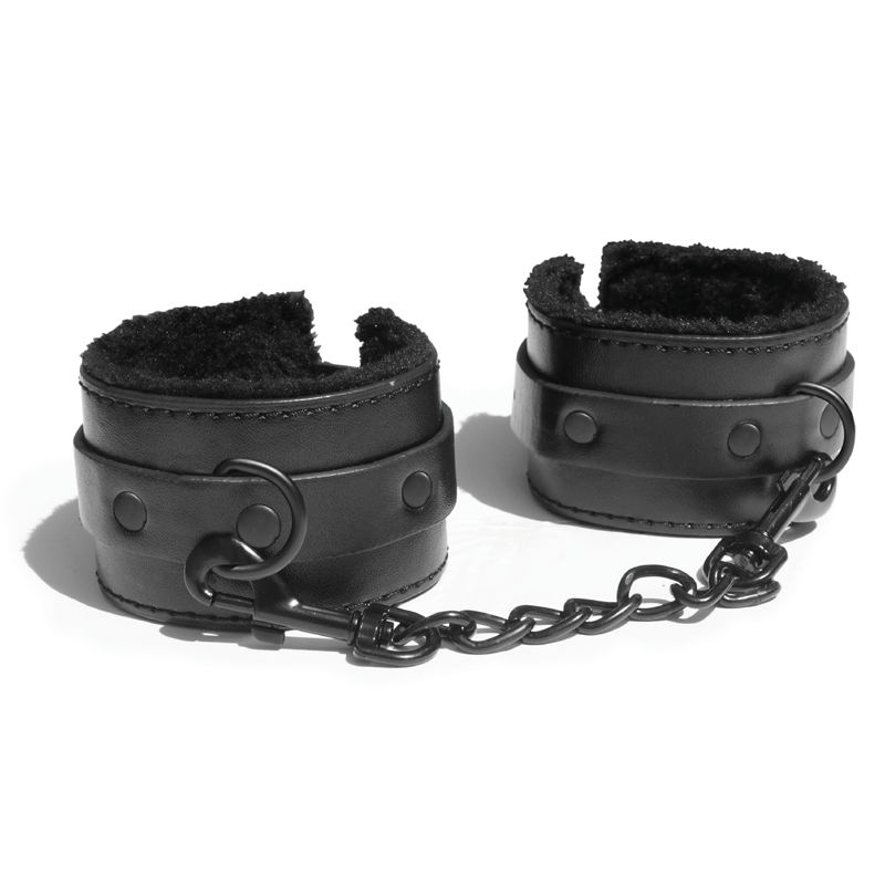 Black faux fur lined vegan leather handcuffs with a metal chain.