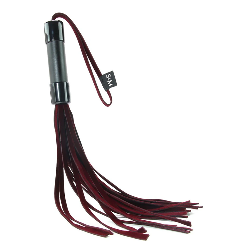 Red velveteen flogger with black handle and wrist loop.