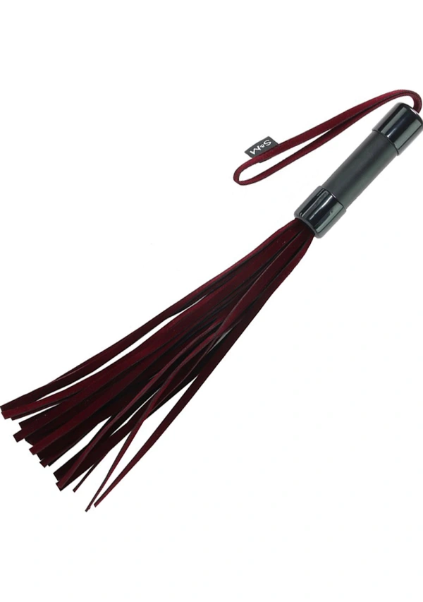 Red velveteen flogger with a black handle and wrist loop.