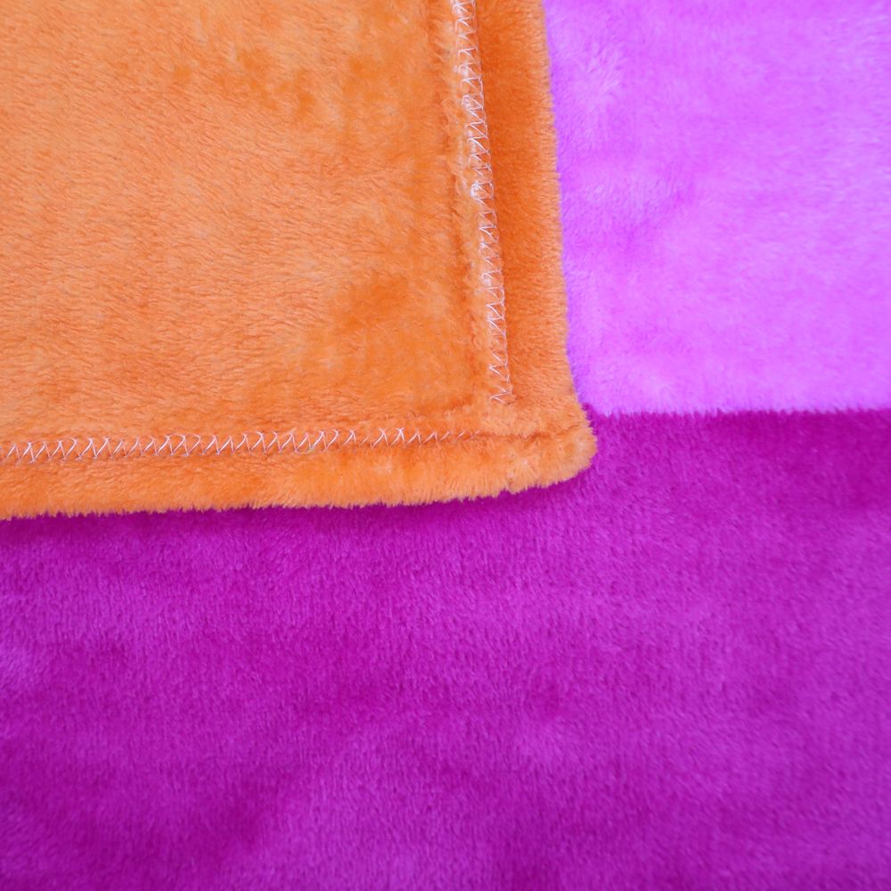 A plush fleece blanket with orange, pink, and purple stripes.