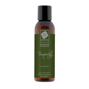 Sliquid Tranquility massage oil in a brown bottle with a green label.