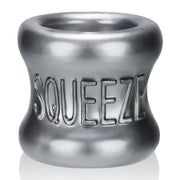 A steel grey ball stretcher with the word "Squeeze" embossed on it.