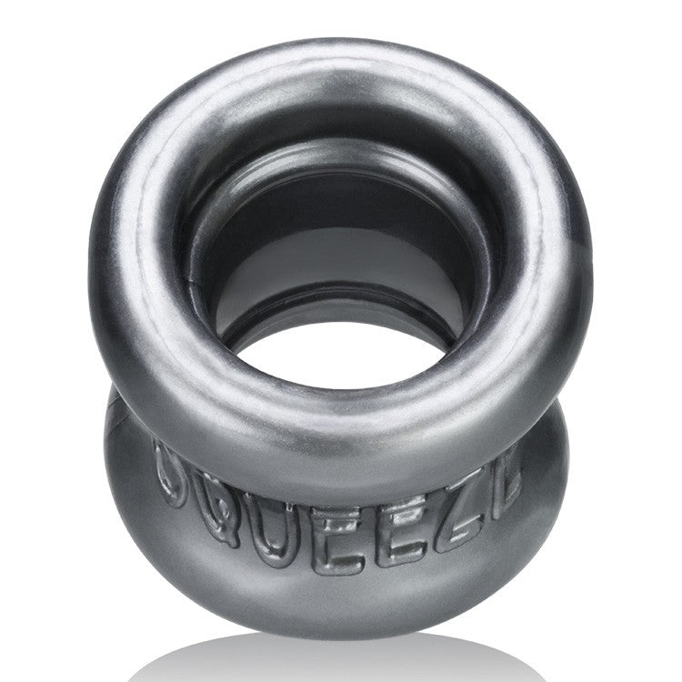 A steel grey Squeeze Soft FLEXtpr ball stretcher with embossed text.