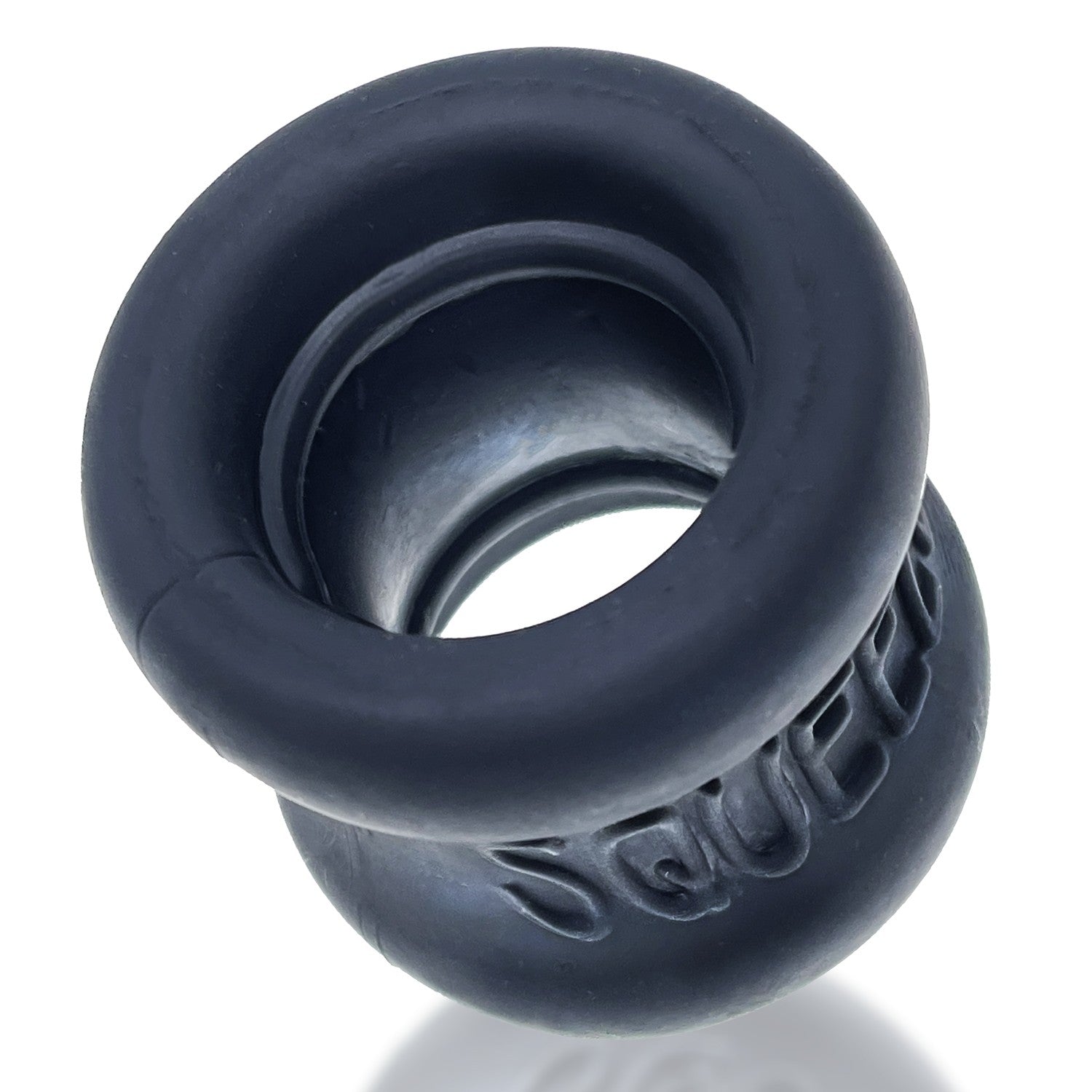 A dark grey, flexible ball stretcher with the word "Squeeze" embossed on it.