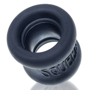 A dark grey, flexible ball stretcher with the word "Squeeze" embossed on it.