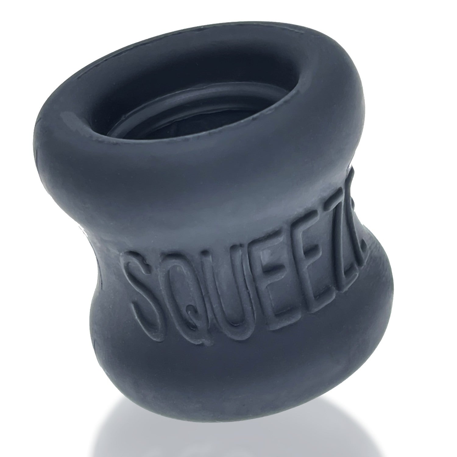 A dark gray, flexible ball stretcher with the word "SQUEEZ" embossed on it.