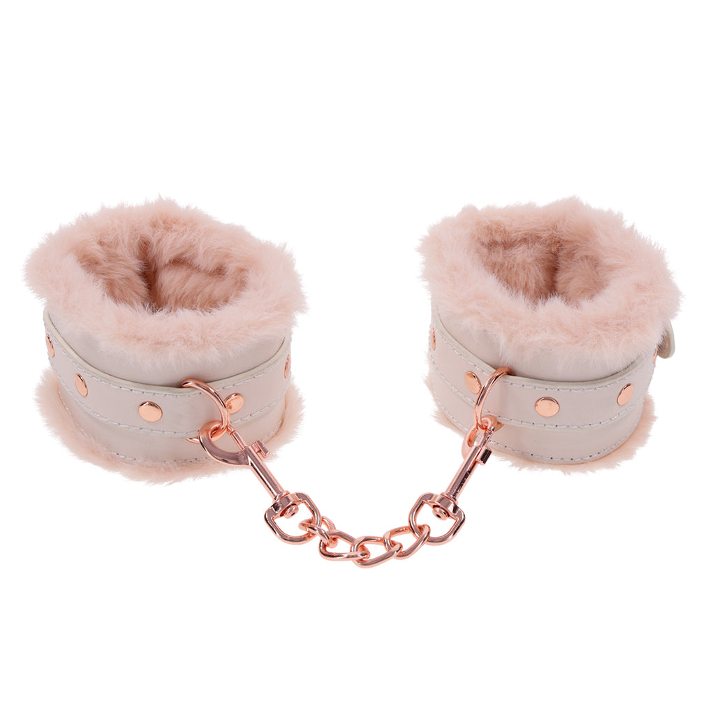 Peach faux fur handcuffs with rose gold hardware and chain.