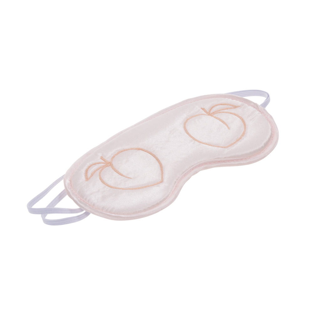 Pink satin blindfold with embroidered peaches and elastic bands.