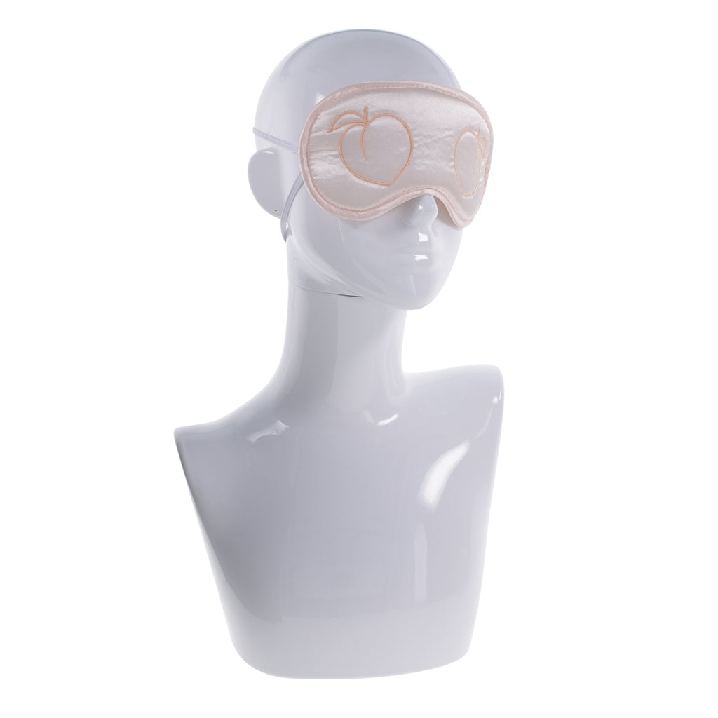 Satin padded blindfold with elastic bands and peach embroidery.