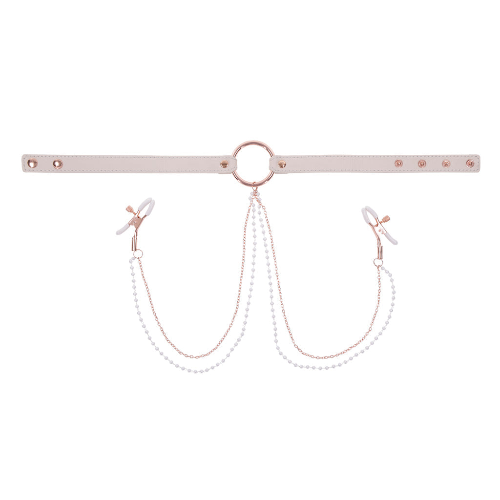 Faux leather collar with rose gold ring, pearl chains, and nipple clamps.