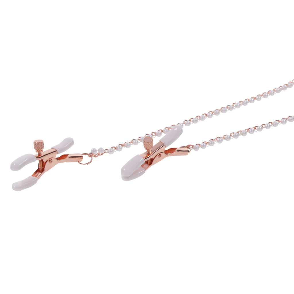 Rose gold nipple clamps with white faux pearl chain.