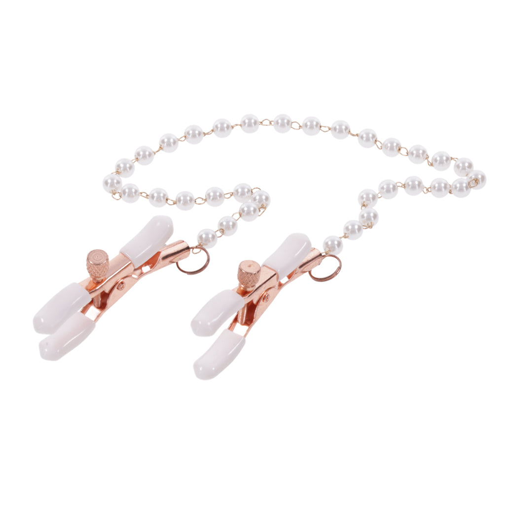 Rose gold nipple clamps with white rubber tips connected by a pearl chain.