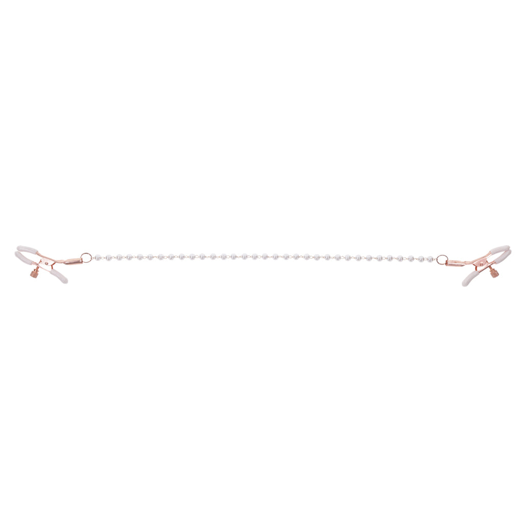 Rose gold nipple clamps with a pearl chain and white rubber tips.