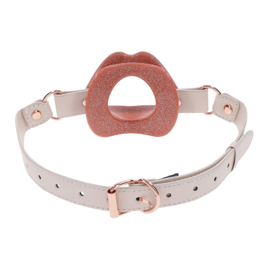 Silicone lip gag with faux leather strap.