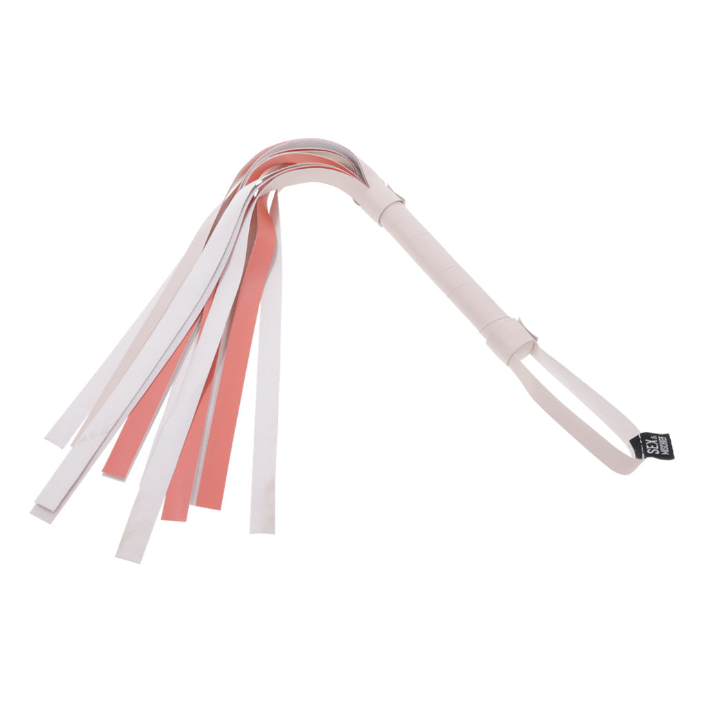 Faux leather flogger with white and rose gold strips and a striped handle.