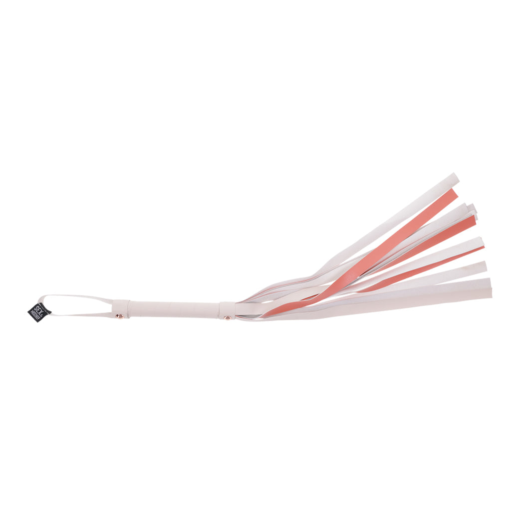Faux leather flogger with white and rose gold strips.