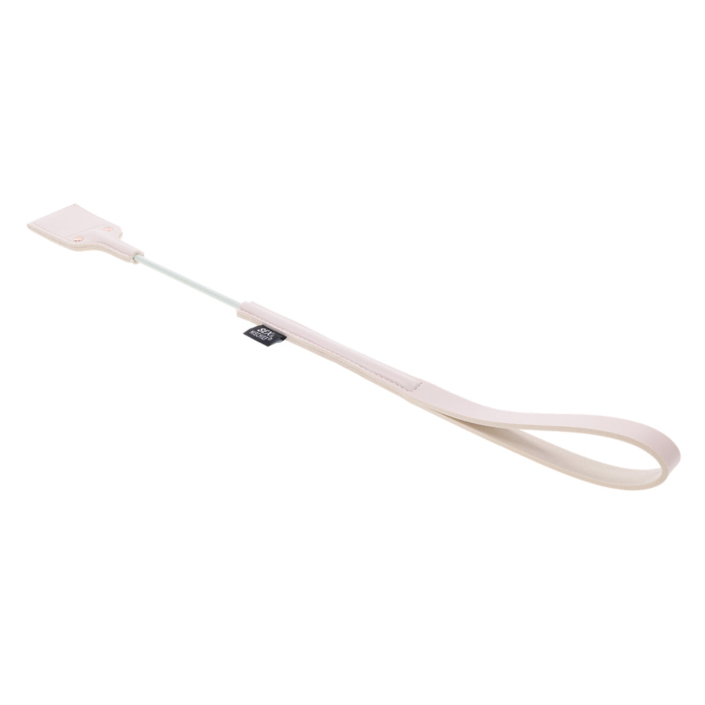 A peach-colored faux leather riding crop with a peach cutout on the tip.