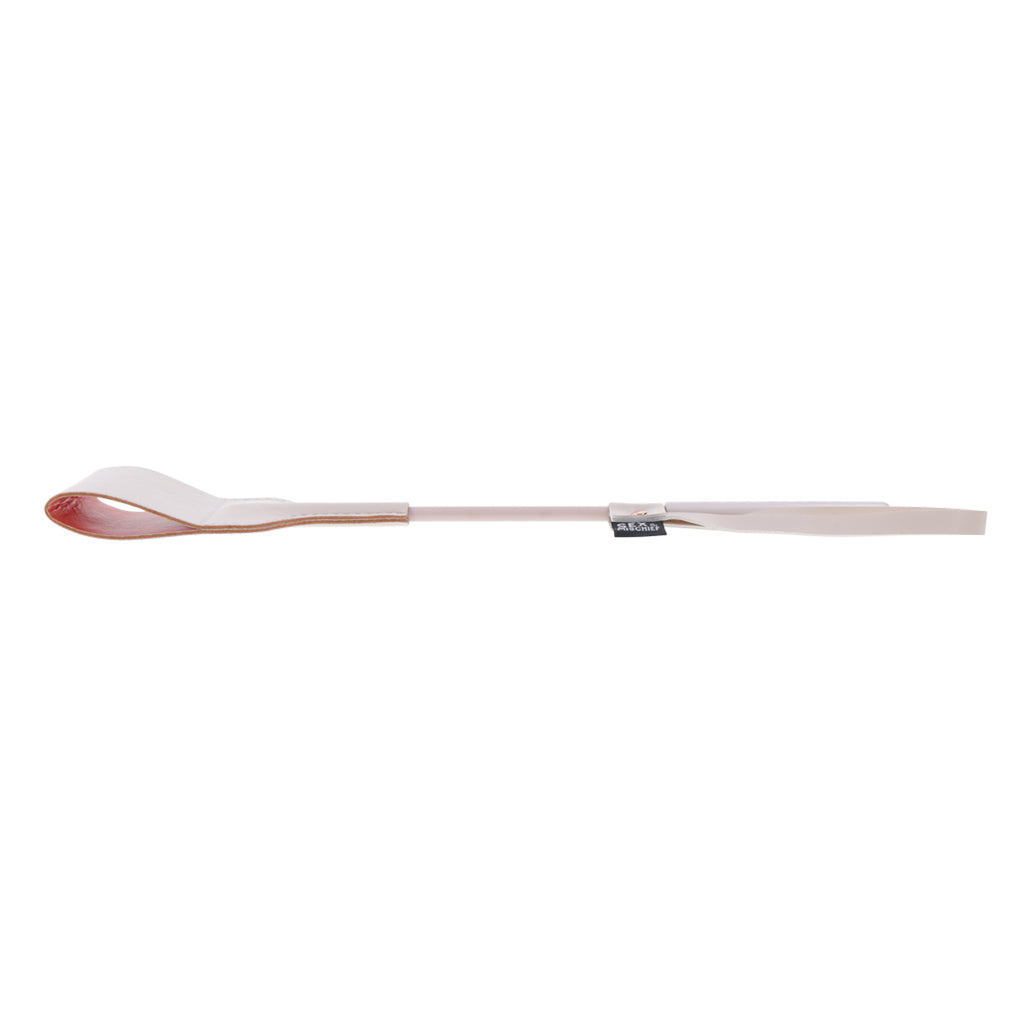 Peach faux leather riding crop with a looped tip.