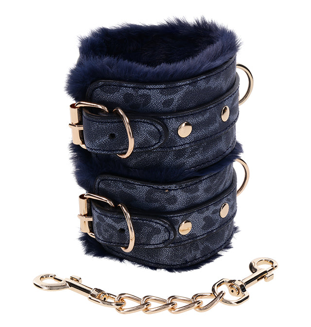 Navy faux fur lined handcuffs with gold hardware and chain.
