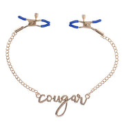 Gold chain nipple clamps with "cougar" script and blue tips.