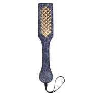 Blue leopard print faux leather paddle with gold studs and a wrist loop.