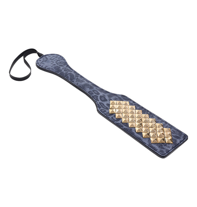 Blue leopard print faux leather paddle with gold studs and a wrist loop.