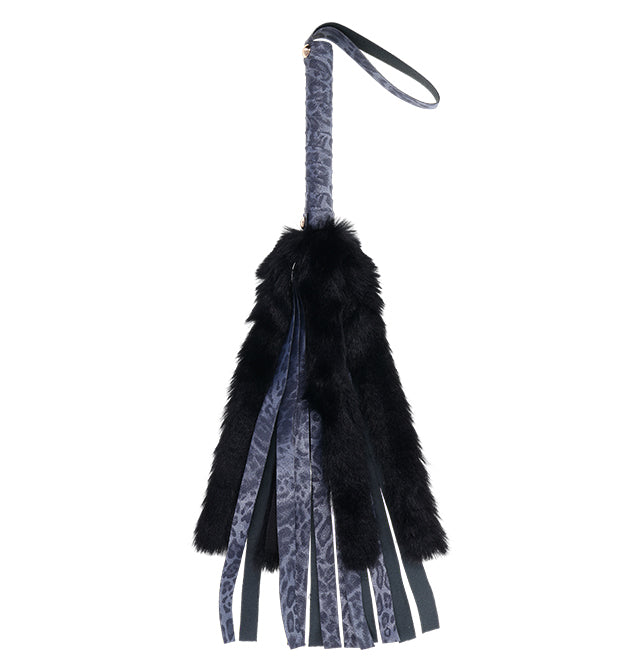 Navy blue faux fur and leather flogger with a patterned handle.