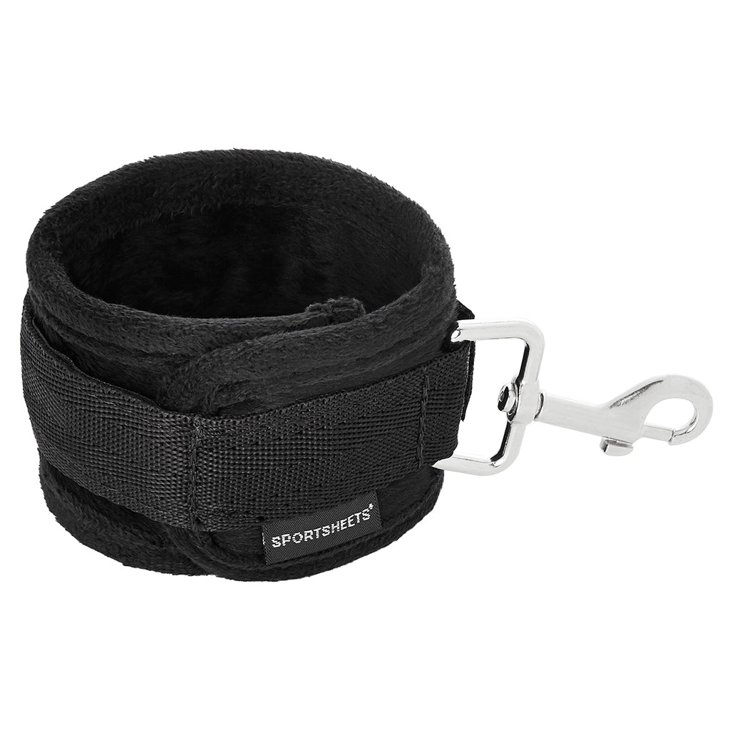 Black adjustable cuff with a metal clasp and "Sportsheets" logo.