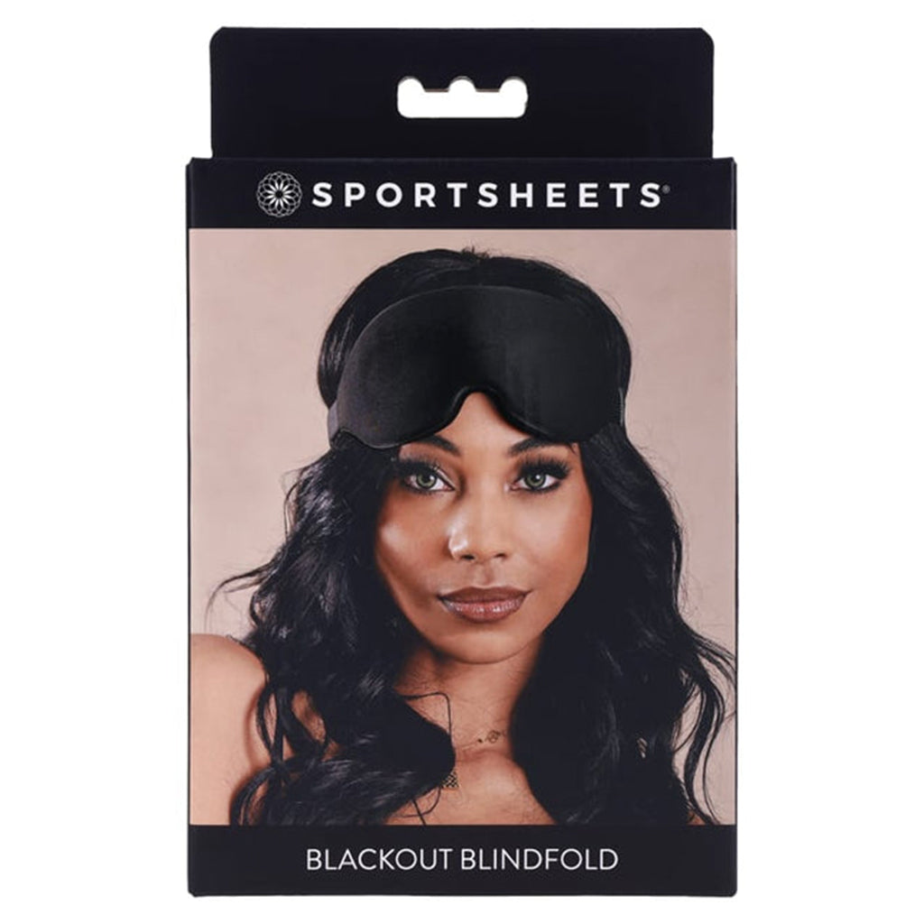 Blackout blindfold with adjustable strap on a box featuring a woman wearing it.