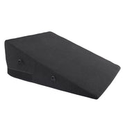 Black foam wedge with restraint loops.