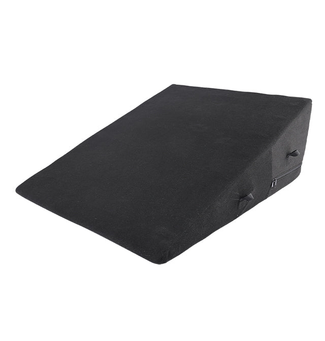 Black foam wedge with restraint loops and zipper.