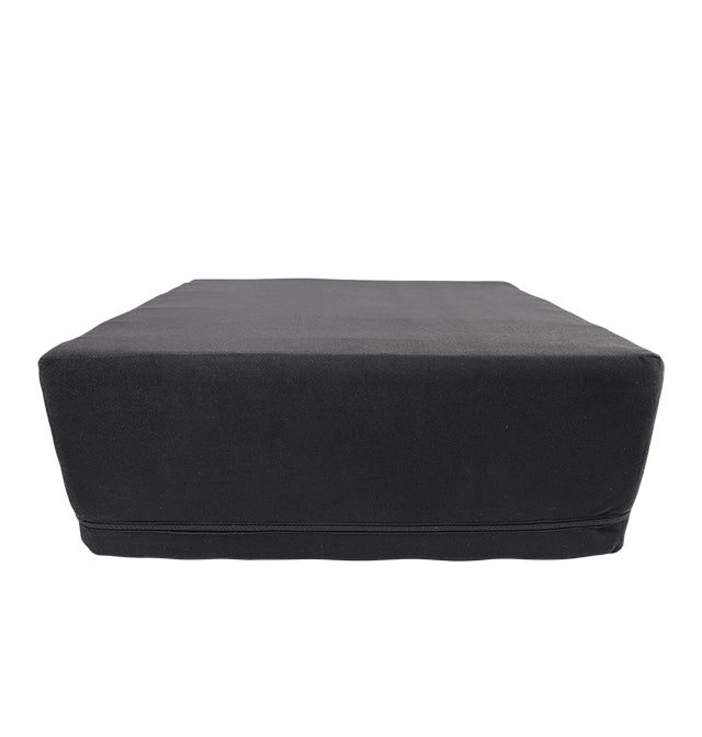 Black foam wedge with restraint loops.