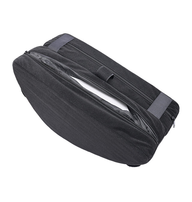 A black convertible toy mount and hip lift support with zippers and straps.