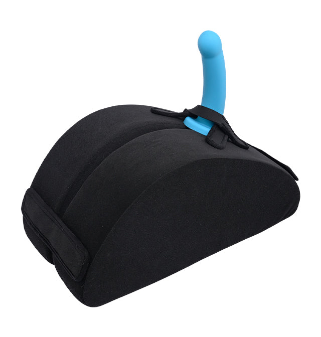 Black foam hip lift support with a blue toy attached.