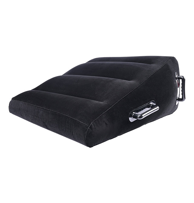 Black inflatable wedge positioner with velvet cover and handles.
