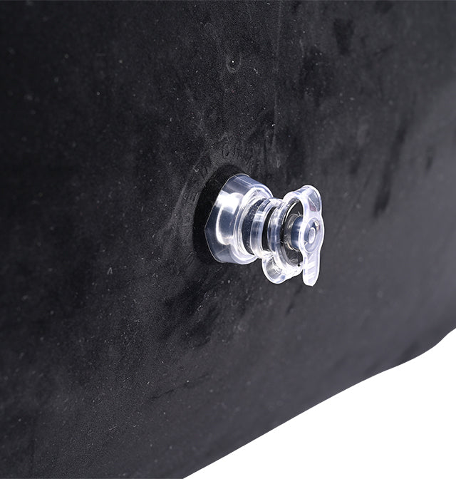 Close-up of a clear plastic valve on a black inflatable ramp positioner.