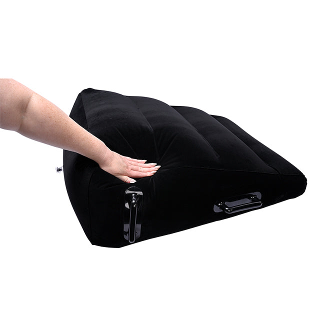 Black inflatable ramp positioner with velvet cover and handles.