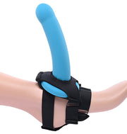 Blue silicone dildo attached to a black neoprene foot harness strap for solo use.