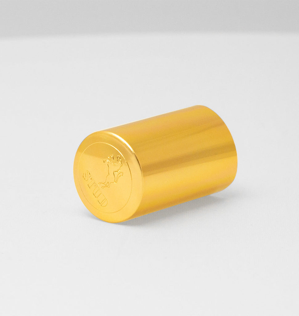 Gold colored Stud 100 delay spray bottle with embossed logo.