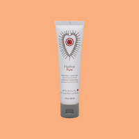 Hathor Pure personal lubricant in a white tube with a red heart design.