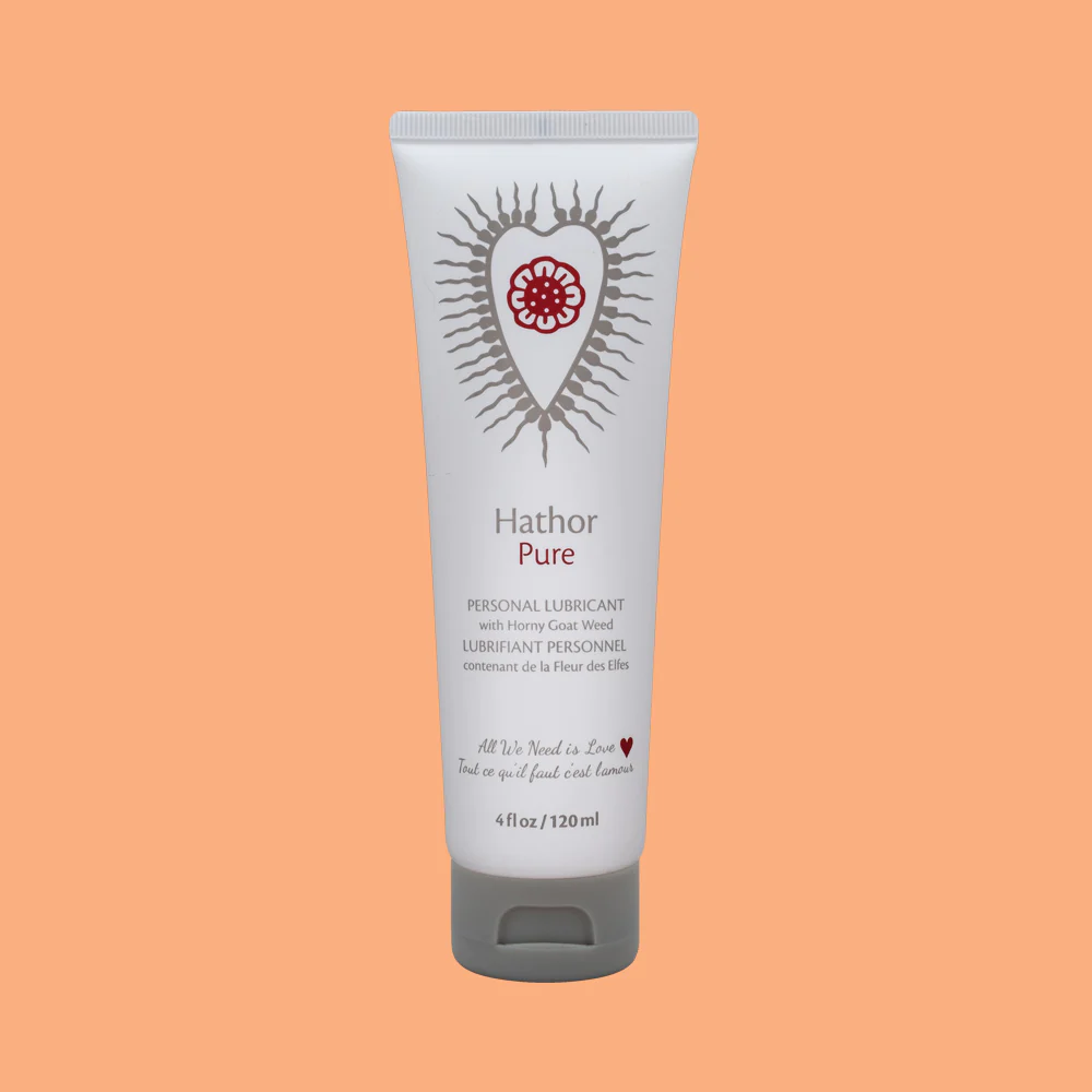 Hathor Pure personal lubricant in a white tube with a red heart design.