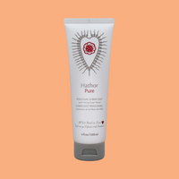 Hathor Pure personal lubricant in a white tube with a red heart design.