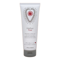 Hathor Pure personal lubricant in a white tube with a red floral heart design.