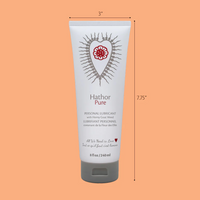 Hathor Pure personal lubricant in a white tube with a floral heart design.