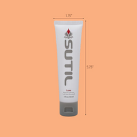 Sutil Luxe water-based personal lubricant in a white tube with a grey cap.