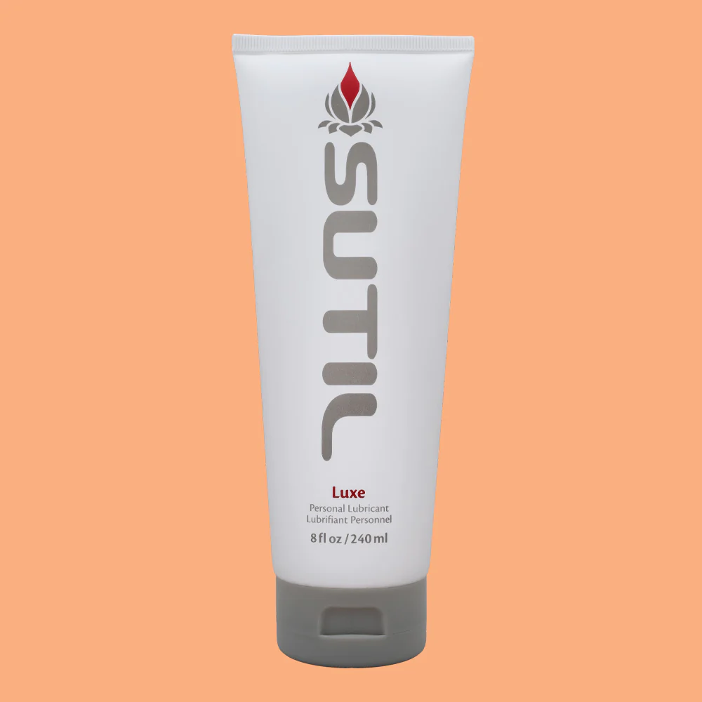 Sutil Luxe water-based lubricant in a white tube with grey cap.