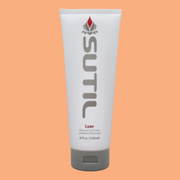 Sutil Luxe water-based lubricant in a white tube with grey cap.